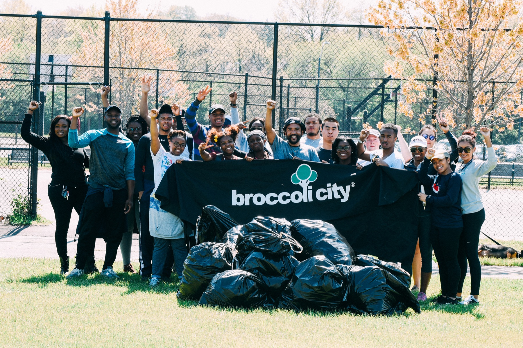 Broccoli City cleanup volunteers standing with collected bags