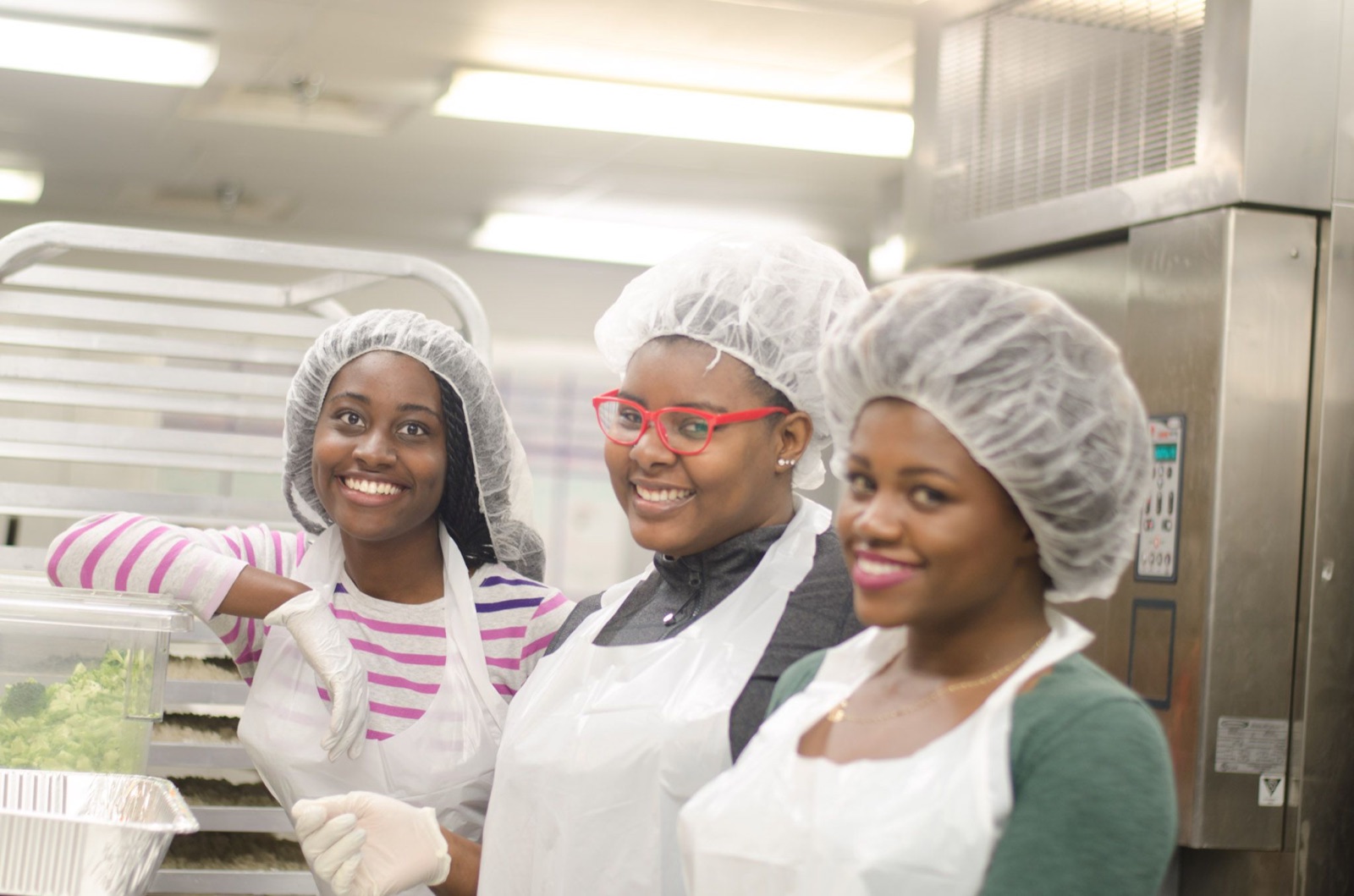 Volunteers preparing food in a kitchen